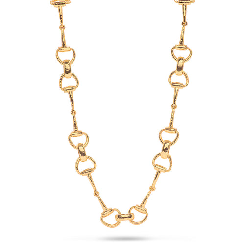 For those who love the majesty of horses, we’ve reinterpreted a classic chain necklace in equestrian form, featuring interlinking snaffle bits. The first bit introduced to a yearling, the snaffle bit symbolizes gentleness and communication while its radiant gold finish is a reminder that sometimes you have to just jump the fences and blaze your own trail. Timeless, sculptural and chic, this necklace delivers the perfect dose of glamor and gumption to your favorite pair of jeans or cocktail dress. 