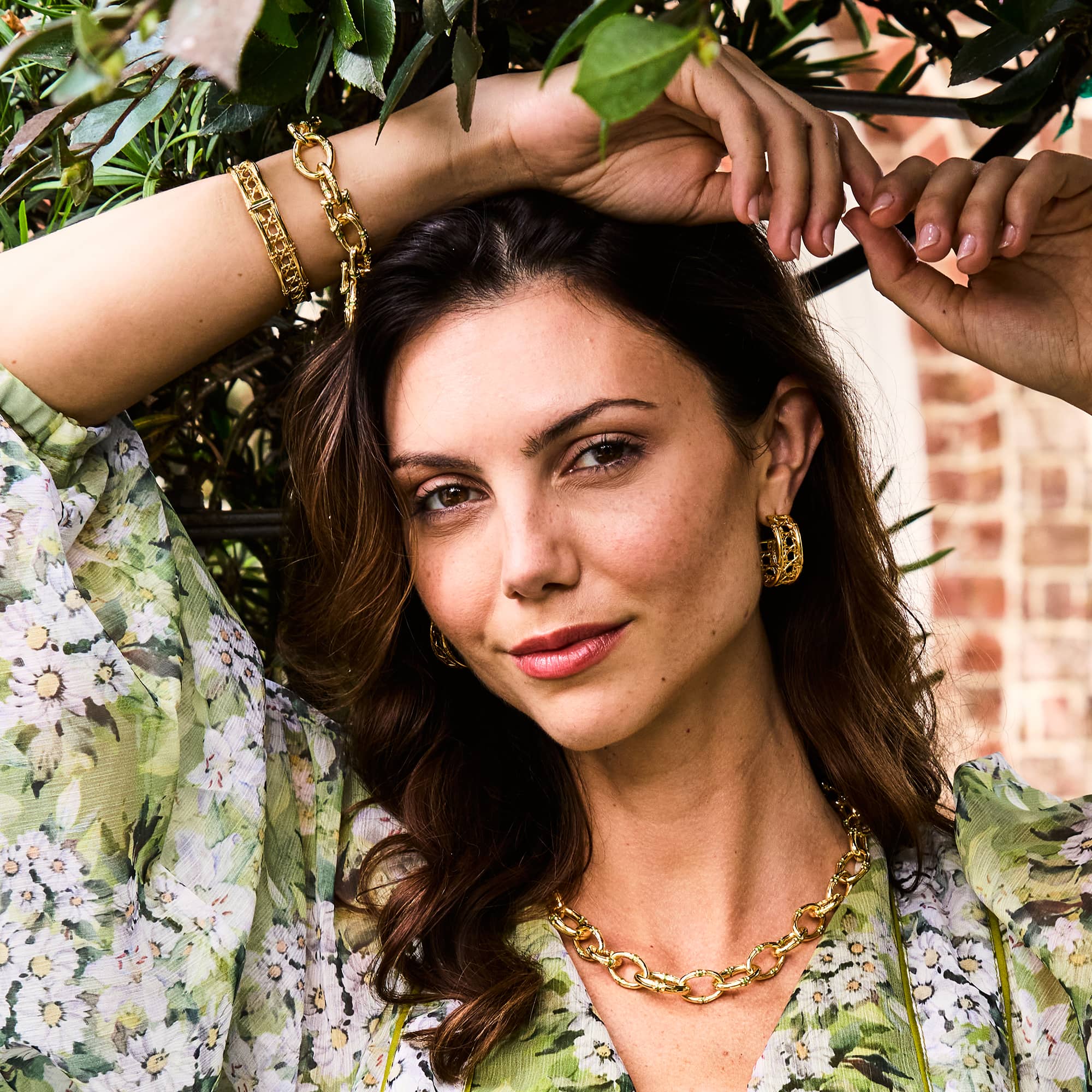 Model posing under a tree wearing bangkok bamboo jewelry
