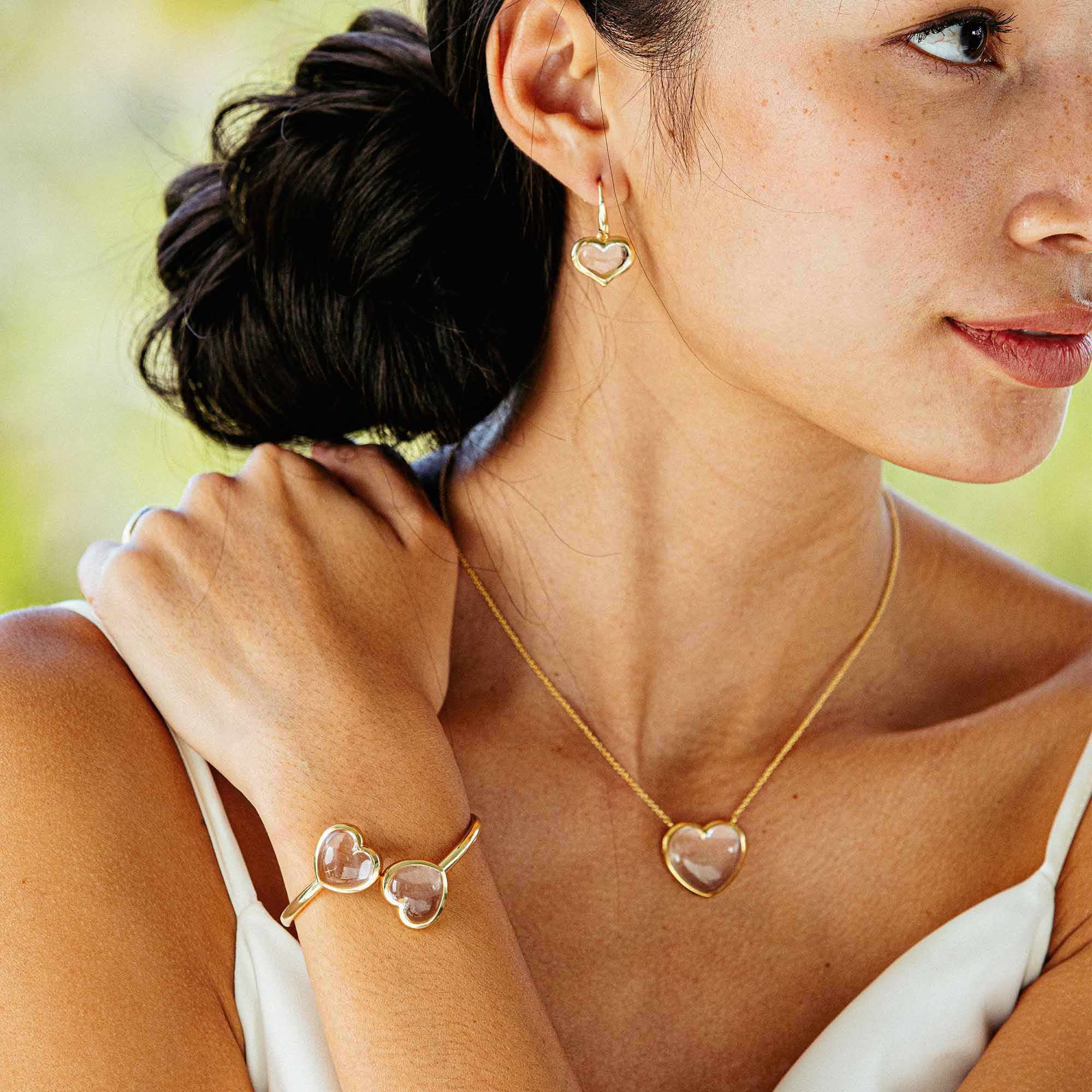 Woman modeling Capucine De Wulf "Love" jewelry