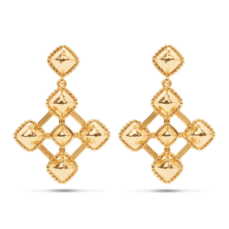 Finding beauty in the shapes of nature — from the circles in tree trunks to the tip of a star —this pair of geometric earrings articulate the perspective that life is art, with their square dance of intersecting lines and right angles done in bright gold that shimmers like the heavens.