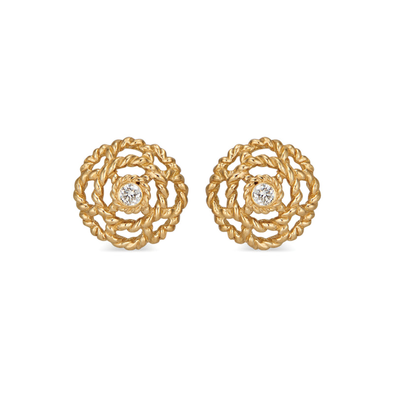 Our iconic blossom, a symbol for spreading Love, has a little diamond nestled at its center set in 18K gold. A classic everyday &amp; everywhere pair of stud earrings.