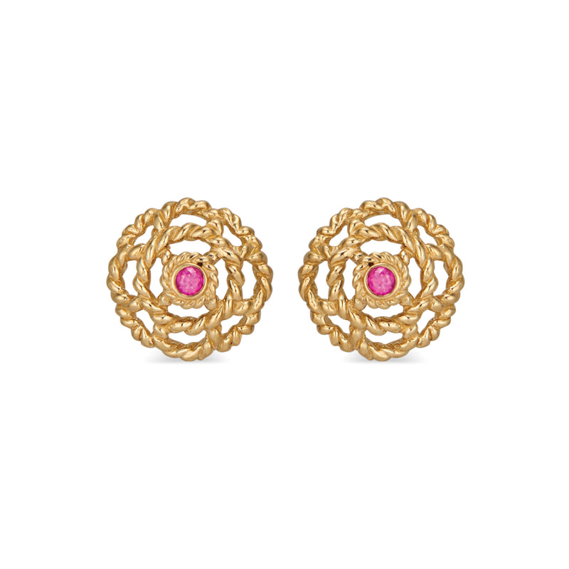  Our iconic blossom, a symbol for spreading Love, has a little ruby nestled at its center set in 18K gold. A classic everyday &amp; everywhere pair of stud earrings.