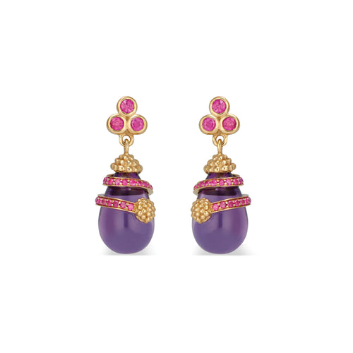 Just as radiant little dew drops nourish the petals they rest upon, even the smallest act of kindness has immeasurable ripple effects.  These stunning Lily Drop Earrings feature rich ruby and alluring amethyst set in 18K gold. 