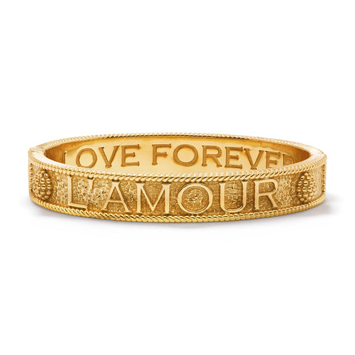 This timeless bangle in gleaming gold is a must have addition to every bracelet stack! Ergonomically shaped for comfort around the wrist with a durable spring hinge for easy on and off. This "Love Forever" bangle is the perfect gift for everyone you know and for any occasion.