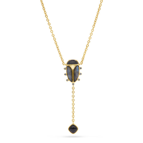A certain conversation starter, this lariat necklace is united by our stunning Scarab, an empowering talisman of resilience. The wings are rendered in a luminescent blue labradorite with black onyx set for the head and geometric drop below.