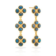 A trio of clovers descend in linear fashion for an effect that’s equally streamlined and romantic. Made with luminous orbs of blue labradorite gemstones with golden berry centers, this set brings femininity and a little luck to carry with you wherever you go.