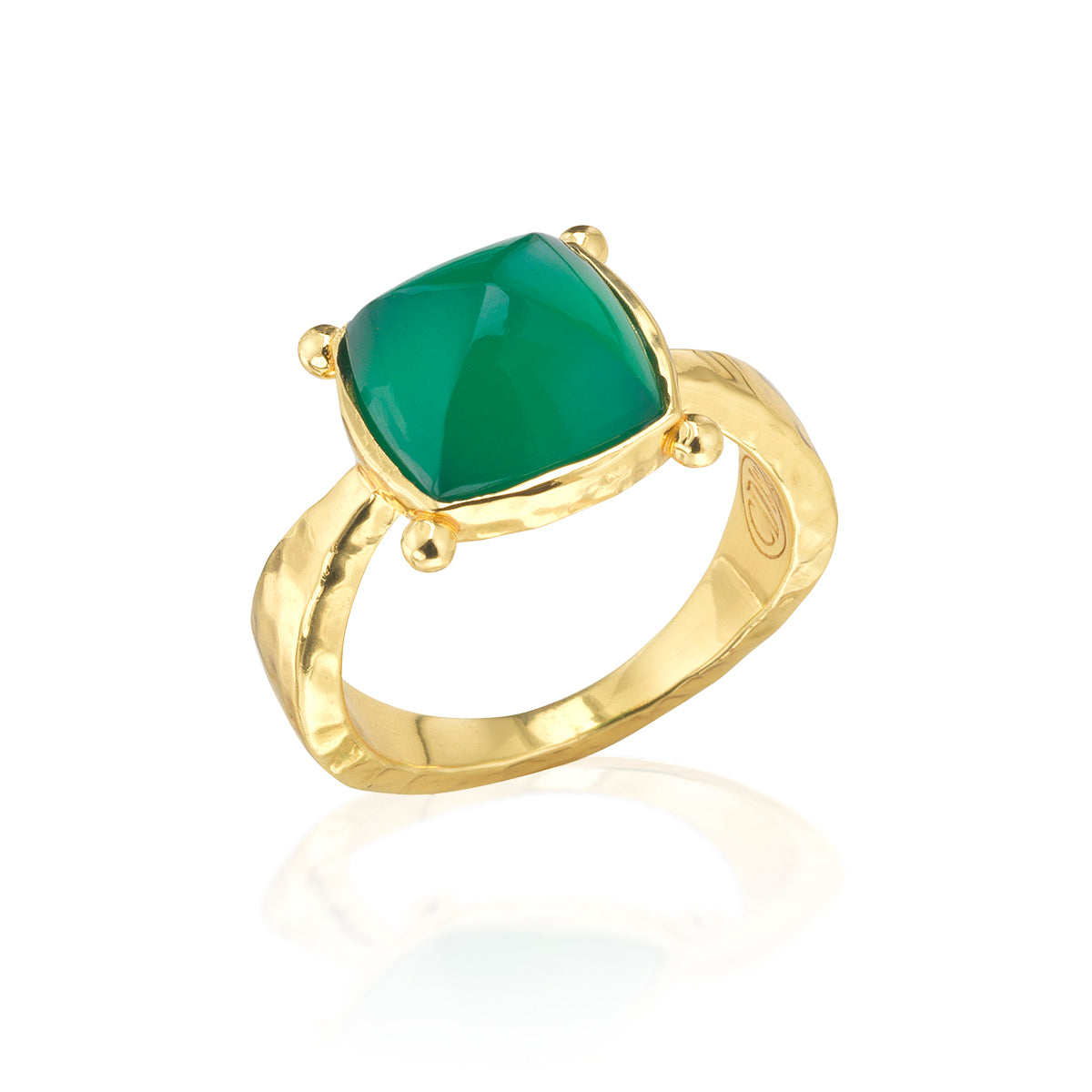 Gold ring with a green gemstone on a white background