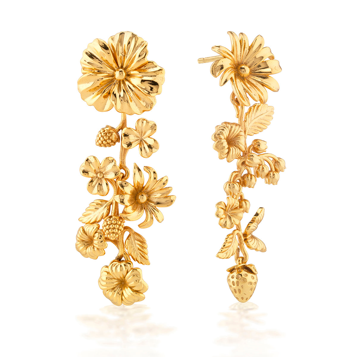 A symphony of wild blossoms, berries, butterflies and leaves descend in a blooming cascade to compose these perfectly mismatched statement earrings that are rendered in bright gleaming gold. As if each botanical element was handmade in intricate detail by Mother Nature herself, this stunning and whimsical pair is what she’d wear to any spring garden party or summer fête.