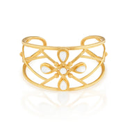 Inspired by Capucine’s incomparable grandmother, Monique De Wulf, who was a true Grande Dame de Paris; unwavering in her spiritual strength, devotion to family (with 9 children!) and passion for dancing. This is a power piece. A subtle compass motif with the points of north, south, east and west in gold and mother of pearl serves as a reminder to trust your instincts and follow your own true north, your inner light. Let your conscience be your compass and you will always choose wisely.