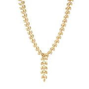 As if crafted by Helen of Troy herself, our laurel wreath glides across the skin with a watery caress, enhancing the beauty of the wearer with its golden gleam. An ancient symbol of triumph, this exquisitely simple garland is a subtle power piece for seizing every day, conquering boardrooms, and sailing down the red carpet with classic style and grace. This convertible necklace can be worn with or without the center drop, so that you can adjust it to suit your neckline.