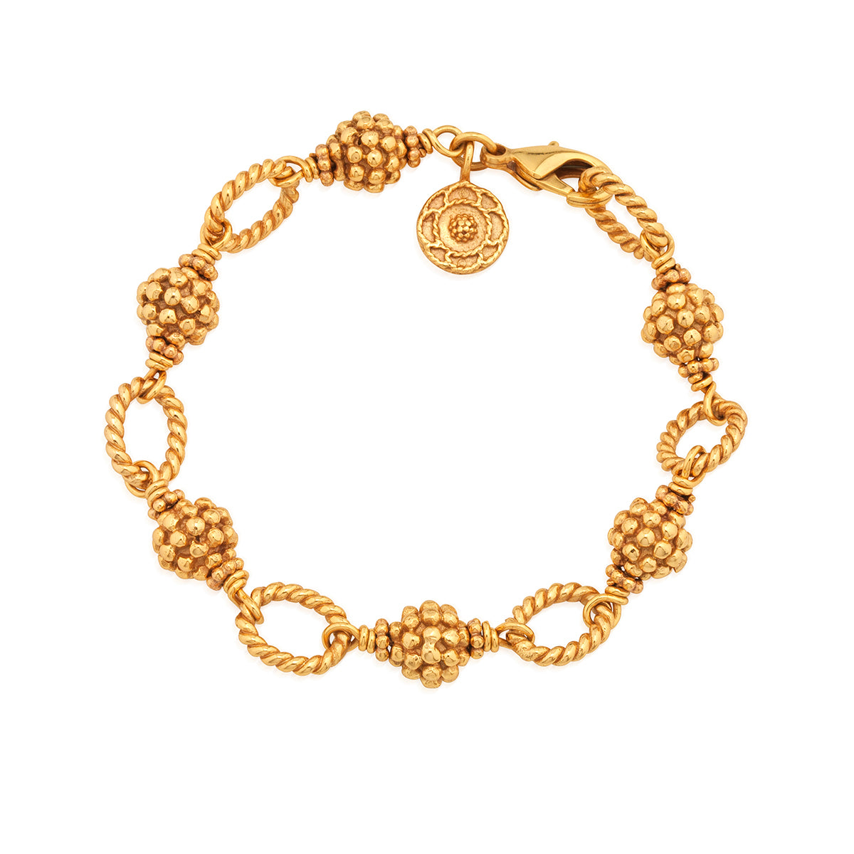 We’ve reimagined the classic bracelet chain with our gorgeous golden berries interspersed with ornate links in our iconic twisting thread. Gloriously versatile, this piece is designed for layering and easily works with any pendant or charm. Just like all women, it can do it all beautifully.