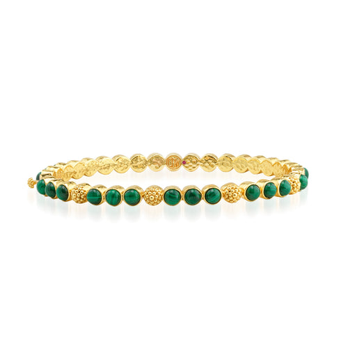 Trios of gorgeous green malachite are united by a sprinkling of golden berries to create this refined bangle that adds a fabulously feminine flourish to any ensemble—whether you’re running a meeting, hosting a dinner party or jet-setting to Monaco.