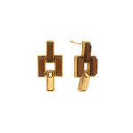 These earrings are symbolic of the many different paths we take in life. Made with rectangular links of teak wood and hammered gold, wear this pair as you follow your own yellow brick road (in fabulous style!), whether it's along city streets, country lanes, the halls of academia or garden pathways.