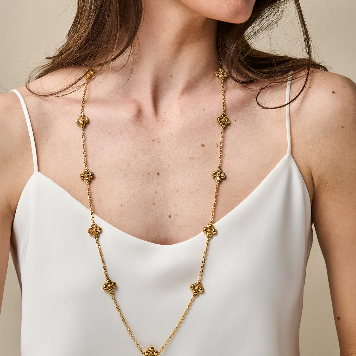 Berry Clover Double Sided Necklace, 34" - Gold close up of necklace on model 