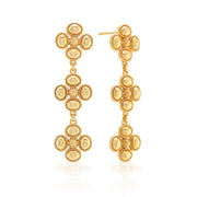 A trio of clovers in gleaming gold with gilded berry centers descend in linear fashion for an effect that’s equally streamlined and romantic—these versatile earrings bring femininity and a little luck to carry with you wherever you go.