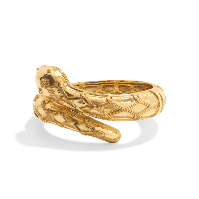 Sleek and exotic, this elegant garden creature is a symbol of flexibility and quick wit. Wrought is shimmering hammered gold with intricate detailing, this whimsical piece adds a fierce layer of smile-inducing sophistication to your ensemble.