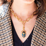 A pendant to wear on any chain, our stunning Scarab is an empowering talisman of resilience that you can carry with you every day. Our modern version of an ancient amulet features luminescent blue labradorite and black onyx. This eye-catching pendant is an unfailingly interesting and unique conversation-starter that adds irresistible charm to your jewelry pieces.