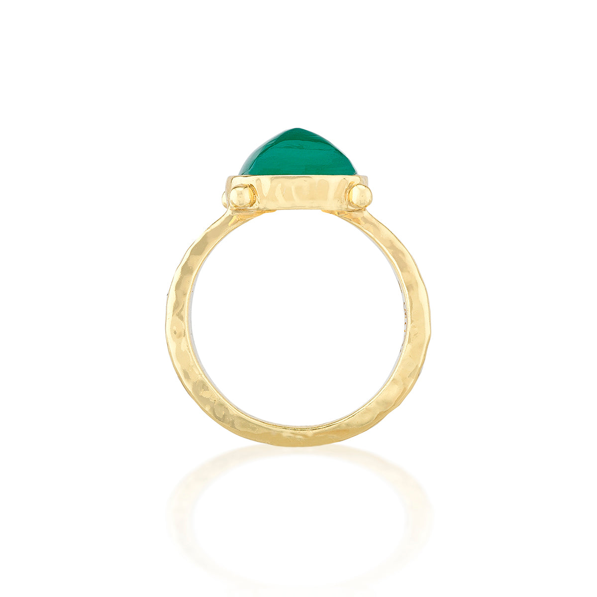 A gold ring with a textured hammered band and a triangular green gemstone set in the center, shown on a clean white background with a soft reflection below.