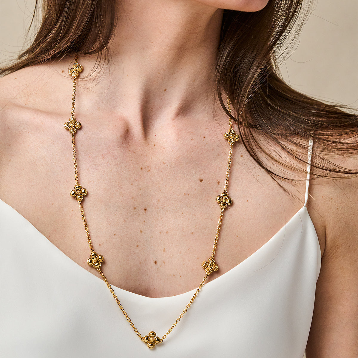 Berry Clover Double Sided Necklace, 28" - Gold close up of necklace on model 