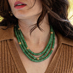 We love to live colorfully. Our triple strand necklace with richly saturated hues of jewel-toned jade beads, strung and polished like pearls and dotted with a sprinkling of golden berries. Simultaneously decadent yet earthy, this bewitching statement piece sings with any outfit, for any occasion. Offered in Ocean Blue, African Violet and Meadow Green.