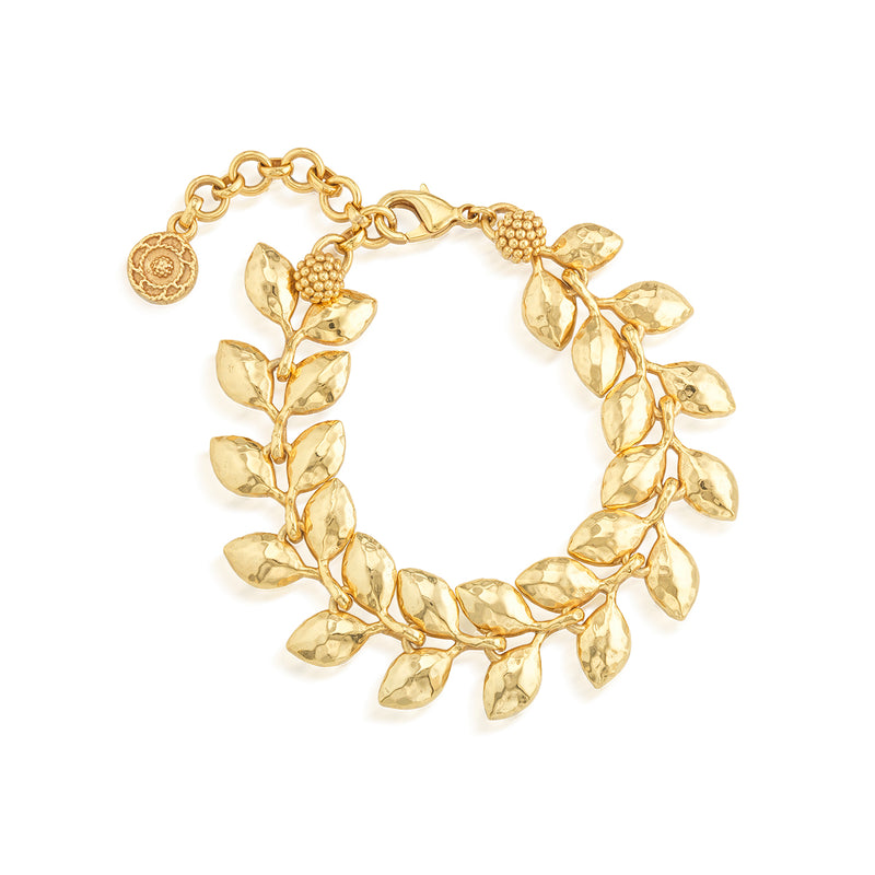 As if crafted by Helen of Troy herself, our laurel wreath glides across the skin with a watery caress, enhancing the beauty of the wearer with its golden gleam. An ancient symbol of triumph, this exquisitely simple bracelet stands the test of time for everything from workdays to weddings to weekends—and everything in between—with classic style and grace.