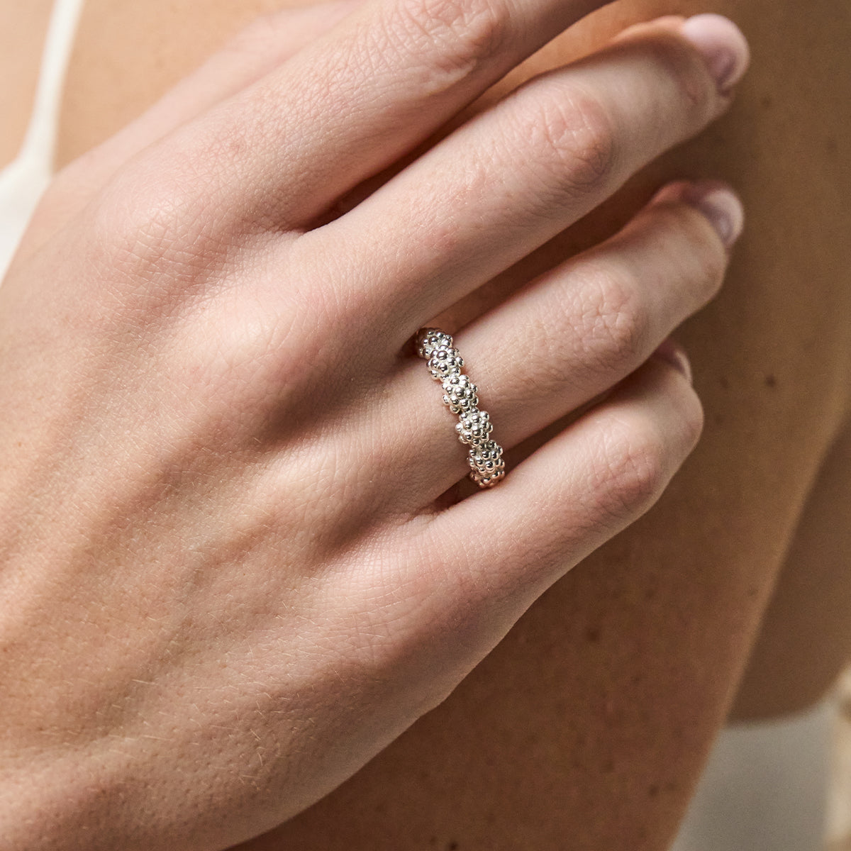 Berry Icon Ring - Silver front close up of ring on finger