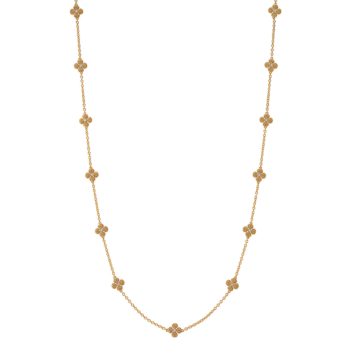 This dainty, double-sided station chain necklace is a vision in bright, gleaming gold and iridescent mother of pearl, interspersed with our clever double-sided clovers that playfully flip throughout the day—from mother of pearl clovers with golden berry centers to golden clovers with mother of pearl centers. Wear it long or doubled around your neck for a layered look.