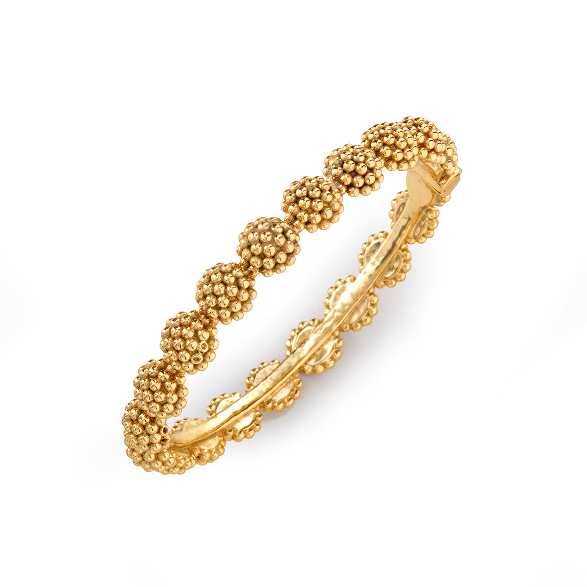 A gold hinged bangle bracelet featuring a textured, beaded floral pattern on the outer band, shown on a clean white background.