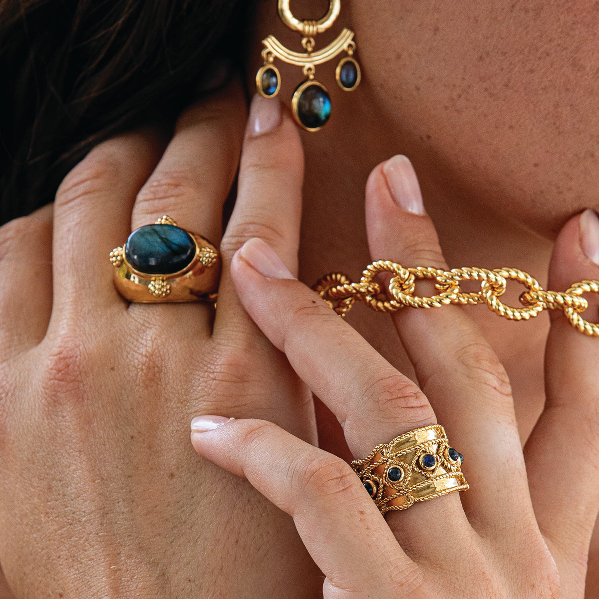 Woman wearing blue and gold jewelry