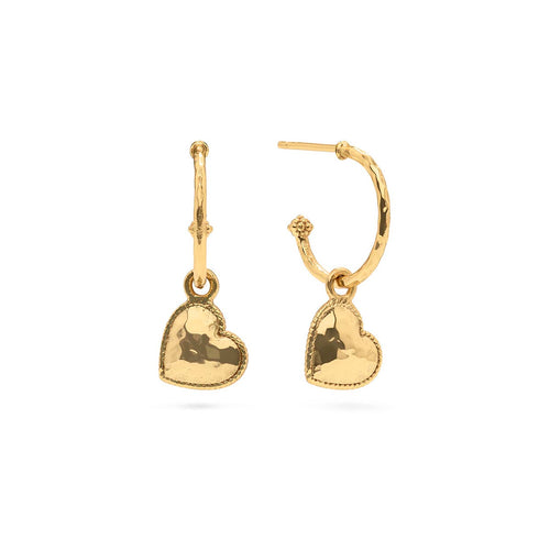 Quintessential hoops wrought in hammered gold, finished with berries, and embellished with dangling heart charms for a feminine flourish you will love wearing every day. 