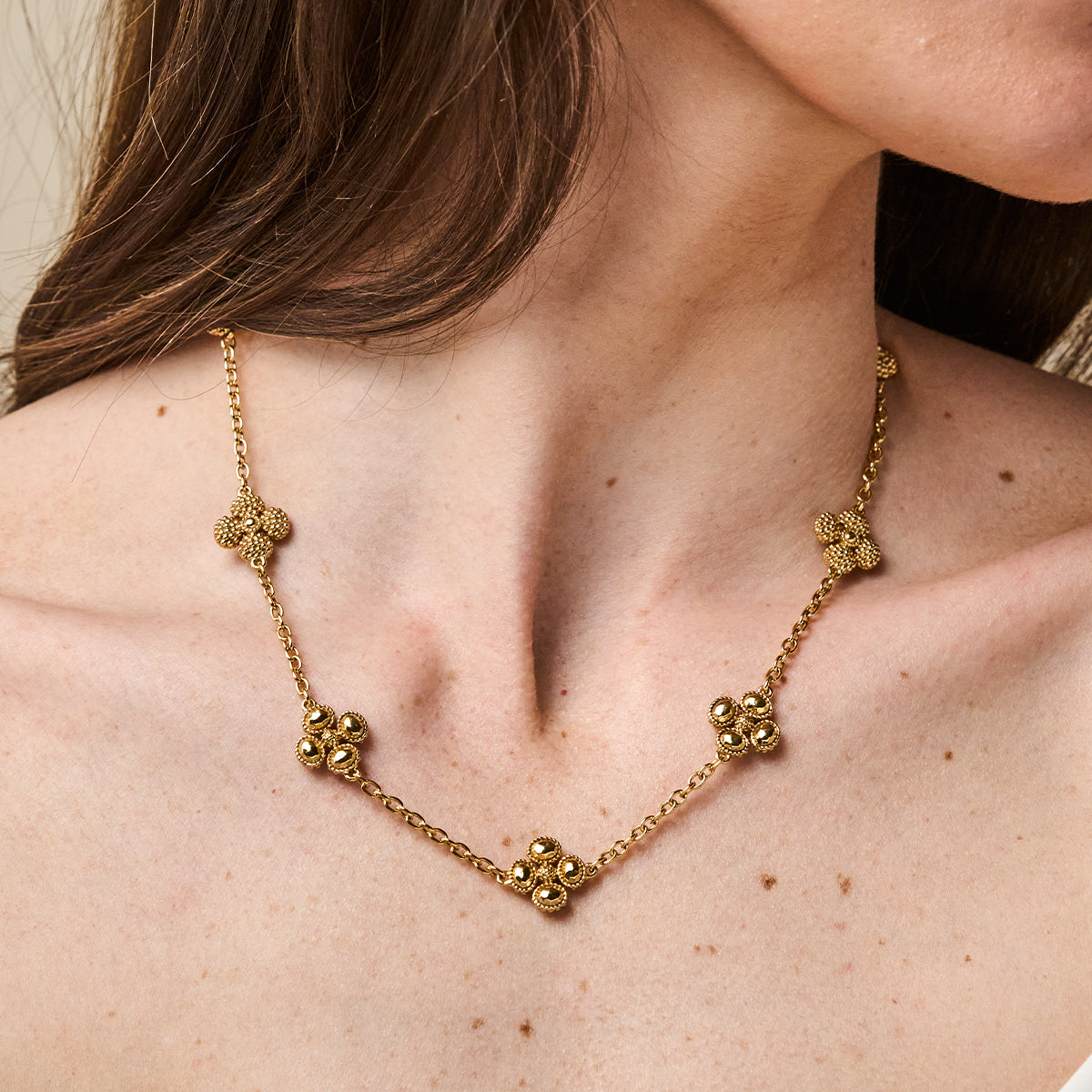 Berry Clover Double Sided Necklace, 16"+2" - Gold close up of necklace on model 