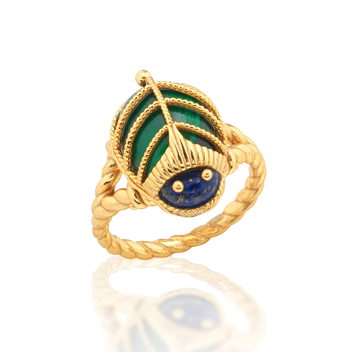 This colorful little character is an empowering talisman of resilience to carry with you every day. Our version of an ancient Egyptian amulet, this sacred scarab features polished malachite wings clad in an ornate, gilded exoskeleton with a lapis head atop a gold ring band.