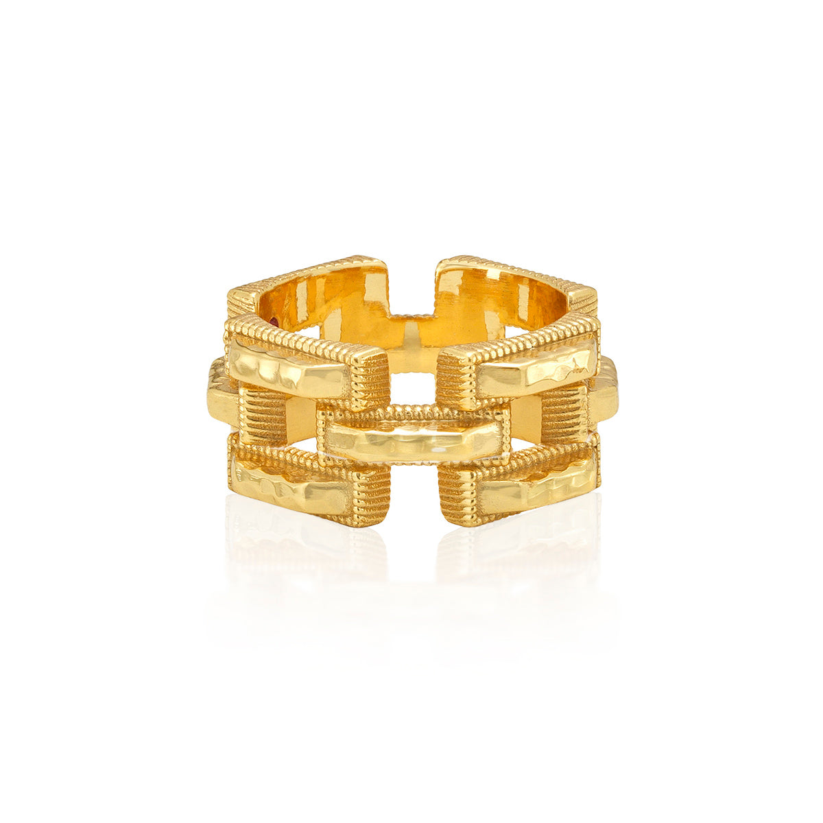 A gold-toned textured link ring with a geometric, interlocking chain-link design, shown on a clean white background with a soft reflection.