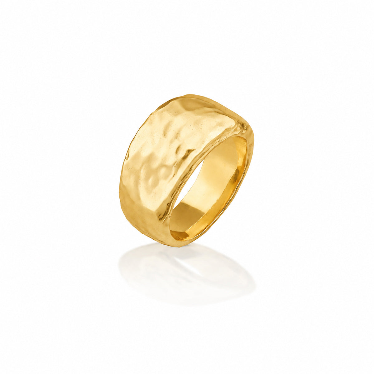 A wide, chunky gold ring with a hammered, textured finish on a clean white background with a soft reflection below.