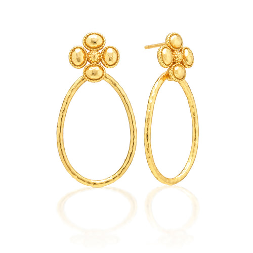 Teardrop hoops of shimmering hammered gold dangle from clover-shaped studs with sweet little berry centers. With understated elegance, this irresistible pair of earrings knows precisely how to make a subtle statement, whether it’s a day at the office or a night out on the town. Lucky you!