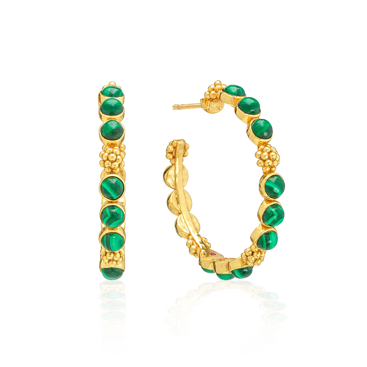 Classic hoop earrings are adorned with lustrous clusters of malachite stones and a sprinkling of golden berries for a look that is polished and feminine. These hoops add a fabulous flourish to any ensemble—whether you’re running a meeting, hosting a dinner party, or jet-setting to Monaco.