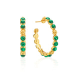 Classic hoop earrings are adorned with lustrous clusters of malachite stones and a sprinkling of golden berries for a look that is polished and feminine. These hoops add a fabulous flourish to any ensemble—whether you’re running a meeting, hosting a dinner party, or jet-setting to Monaco.