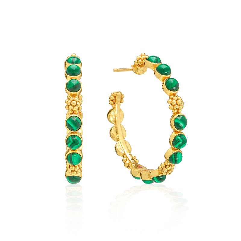Classic hoop earrings are adorned with lustrous clusters of malachite stones and a sprinkling of golden berries for a look that is polished and feminine. These hoops add a fabulous flourish to any ensemble—whether you’re running a meeting, hosting a dinner party, or jet-setting to Monaco.