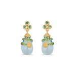 Just as radiant little dew drops nourish the petals they rest upon, even the smallest act of kindness has immeasurable ripple effects. These stunning Lily Drop Earrings feature luminous blue topaz and vibrant tsavorite set in 18K gold. 