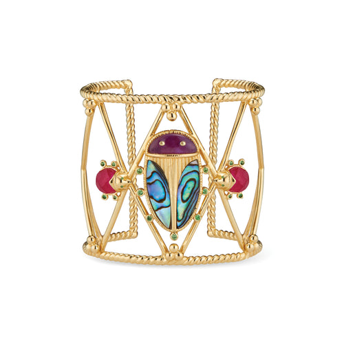 Exotic, regal and refined our stunning Sacred Scarab is an empowering talisman of renewal. Rendered with luminescent hand carved abalone shell polished into noble wings, a royal purple amethyst is set for the head and tiny tsavorite feet sit rest purposefully atop an 18K cuff. The accompanying pair of ruby Lovebugs are the catalyst and nourishment to the ongoing quest for re-newel. 