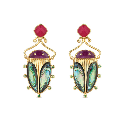 Exotic, regal and refined our stunning Sacred Scarab is an empowering talisman of renewal. The wings are rendered in luminescent, hand-carved and polished abalone shell, a royal purple amethyst is set for the head and 18K gold legs reach for radiant ruby earring posts. 