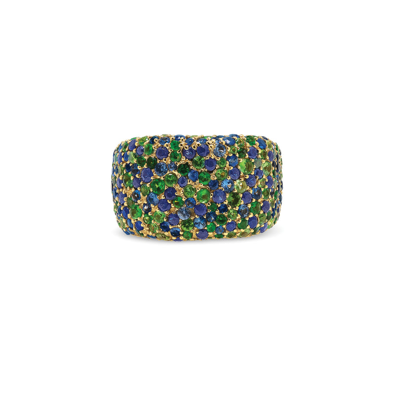 The vibrant blue sapphires and citrus green tsavorites in this decadent ring glisten like over-flowing treasure. An updated classic with variegated stones sizes tightly nested in pirate sized chunk of gold.