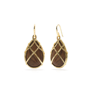 Naturally beautiful, each lustrous teak wood drop is delicately hand carved and adorned in golden bands. From our Earth Goddess Collection, you'll look amazing in these earrings while being reminded to drink in the fresh air and stay grounded.