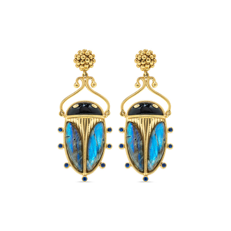 Exotic, regal and refined our stunning Scarab is an empowering talisman of renewal. The wings are rendered in luminescent, hand-carved and polished blue labradorite shell, a black agate is set for the head and 18K flash gold plated brass legs reach for radiant berry earring posts.