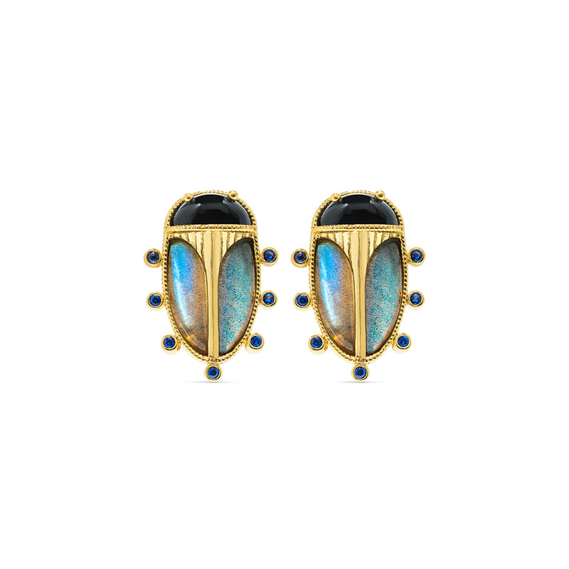 Exotic, regal and refined our stunning Scarab is an empowering talisman of renewal. The wings are rendered in luminescent, hand-carved and polished blue labradorite shell, a black agate is set for the head and 18K flash gold plated brass on radiant gold clip.