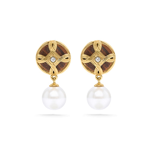 Effortlessly chic, these perfectly proportioned earrings of hand-carved teak wood and pearls with a tiny crystal center, look perfect with practically everything. These are a great go-to earring for the jet-setting woman. 