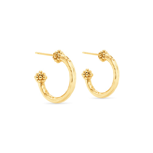The quintessential gold hoop, wrought in hammered gold and finished with a berry, is anything but ordinary.