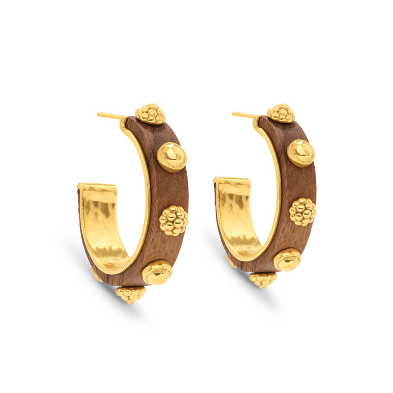 The Greek goddess personifying Earth, Gaia is strong, protective and nurturing. These hand- carved teak wood earrings are accented with gleaming gold and are a natural neutral that transitions beautifully from casual to formal and day to night.