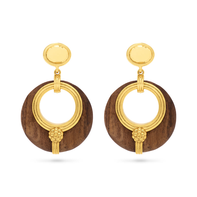 The Greek goddess personifying Earth, Gaia is strong, protective and nurturing. These hand- carved teak wood hoops are accented with gleaming gold and are a natural neutral that transitions beautifully from casual to formal and day to night.