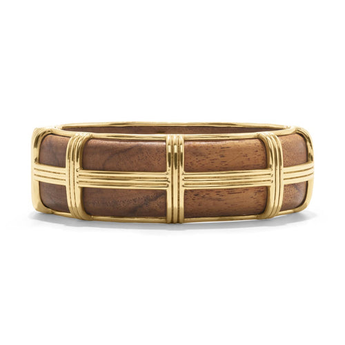 The Greek goddess personifying Earth, Gaia is strong, protective and nurturing. This hand- carved teak wood bangle is accented with ley-lines of gleaming gold and is a natural neutral that transitions beautifully from casual to formal and day to night.